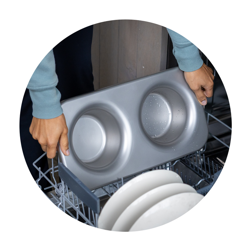 Person removing a pristine clean Better Bowl from a dishwasher.. Pop-out inner bowl. Dishwasher safe.